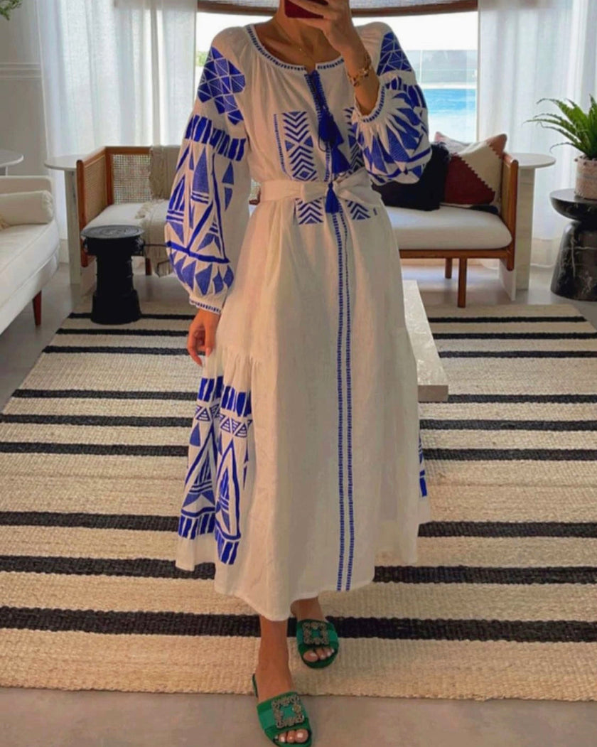 White linen kaftan maxi dress with blue geometric embroidery, balloon sleeves, tassel ties and self-tie belt, mirror styled view - Zalxndra Resort