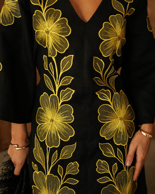 Close-up of bold gold floral embroidery on black linen kaftan maxi dress - Zalxndra Resort