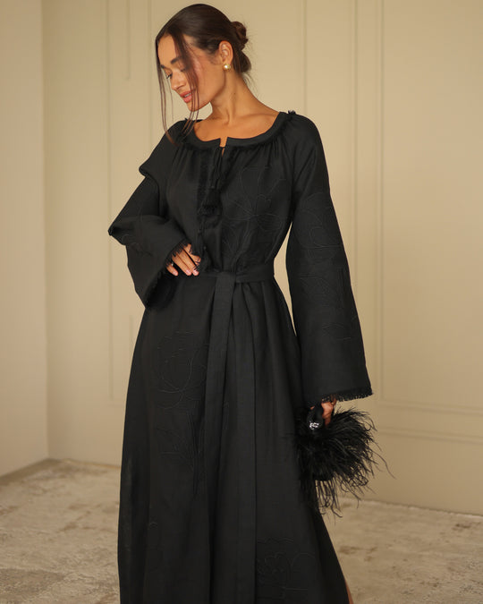 Close-up of black linen kaftan maxi dress showing tonal floral embroidery and frayed bell sleeve detail - Zalxndra Resort