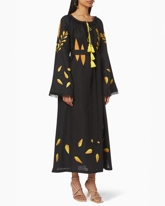 Black linen kaftan maxi dress with yellow and orange leaf embroidery, angel sleeves with frayed trim, yellow tassel ties and self-tie belt, front view - Zalxndra Resort