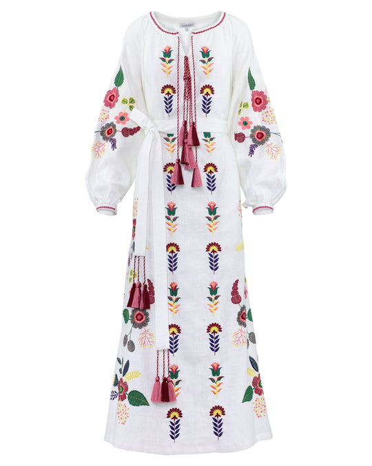 White linen kaftan maxi dress with multicolour folk floral embroidery, balloon sleeves, self-tie belt, and tassel ties, front view - Zalxndra Resort