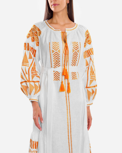 Bodice detail of white linen kaftan maxi dress with orange geometric embroidery, balloon sleeves, and tassel ties - Zalxndra Resort
