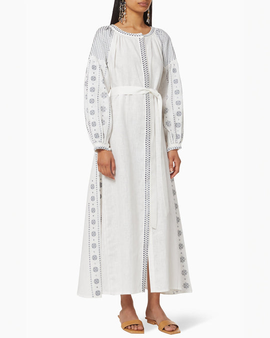 White linen kaftan maxi dress with slate geometric embroidery, balloon sleeves, button closure and self-tie belt, front view - Zalxndra Resort