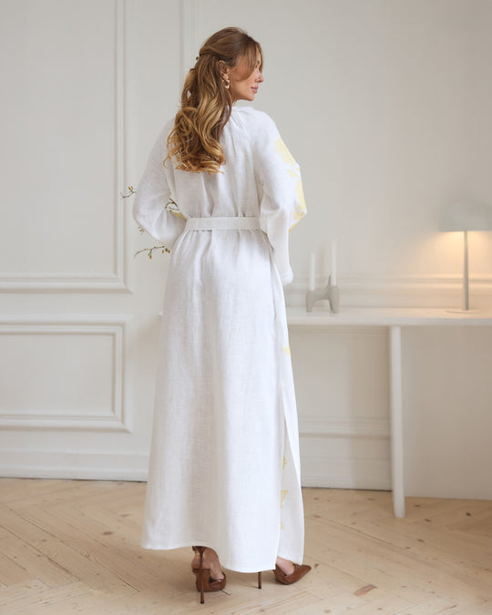 Back view of white linen kaftan maxi dress with yellow floral embroidery and angel sleeves - Zalxndra Resort