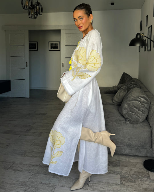 Side view of white linen kaftan maxi dress with yellow outlined floral embroidery and angel sleeves - Zalxndra Resort